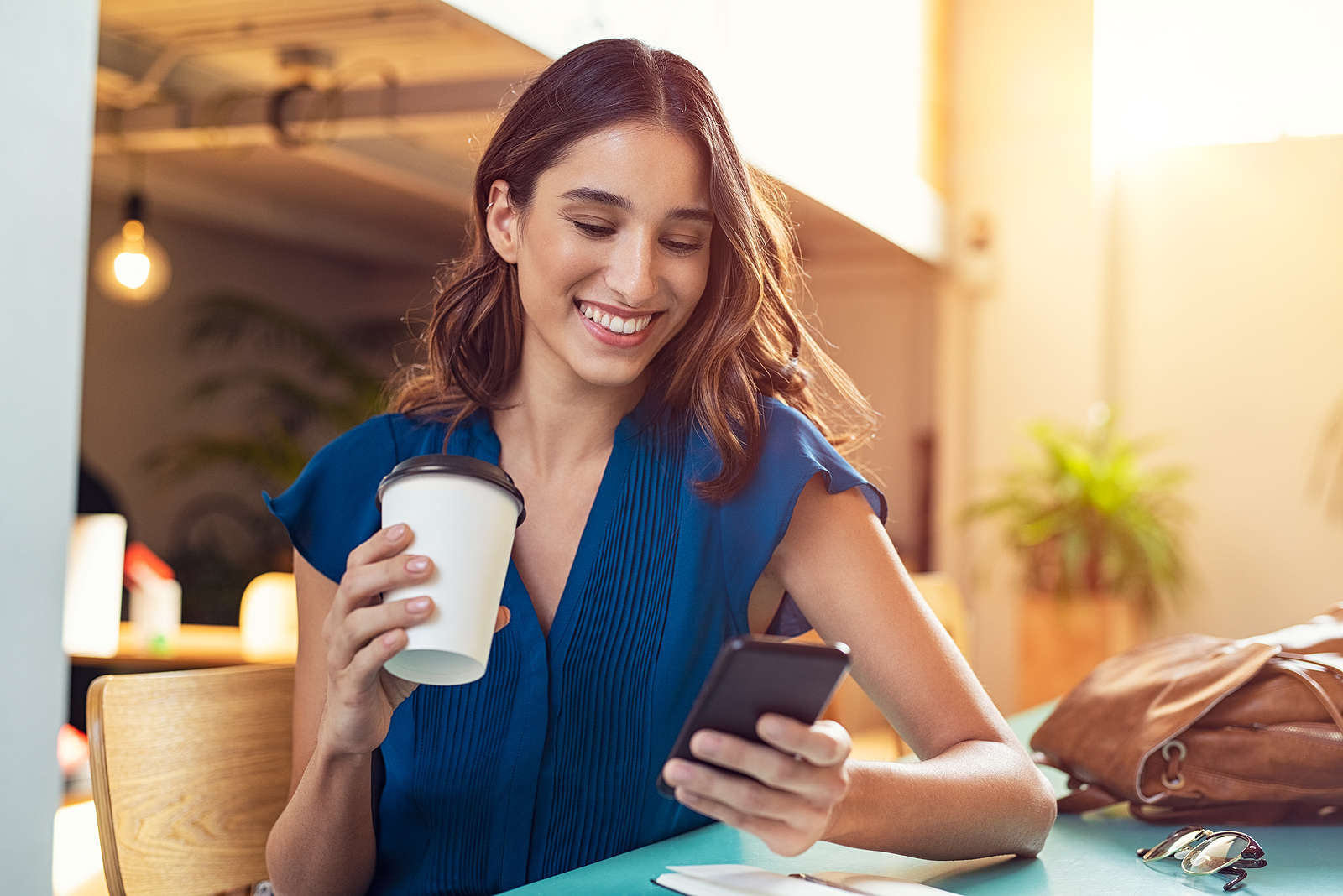 Young woman looking at her cell phone.